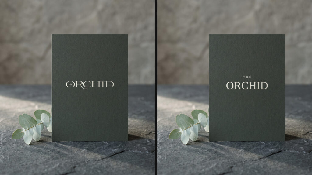 Two versions of the same business card on stone, differing only in the logo