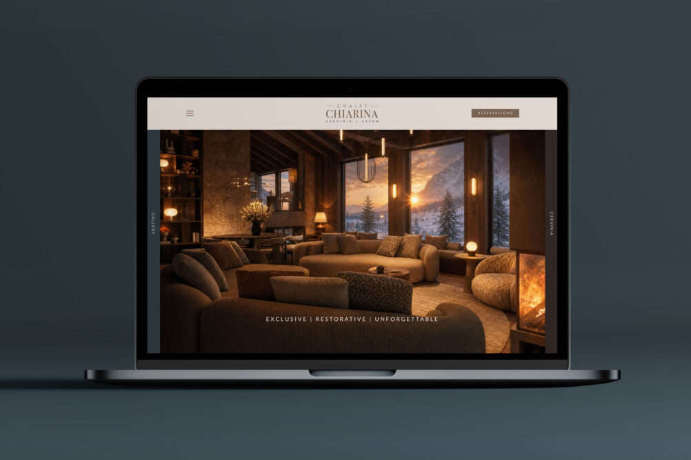 Exclusive luxury hospitality website - laptop display on table