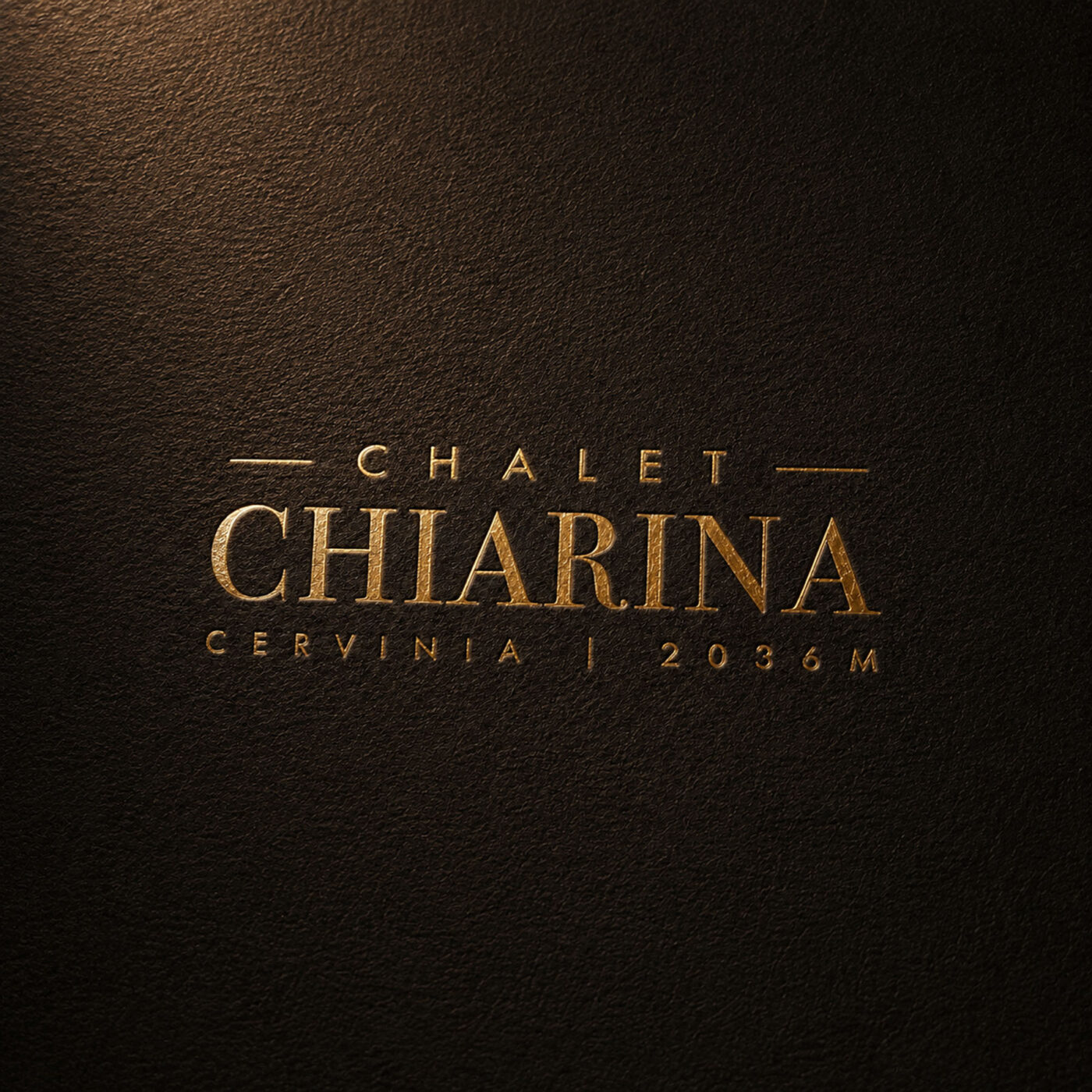luxury chalet cervinia brand identity design - logo in gold foil on textured card