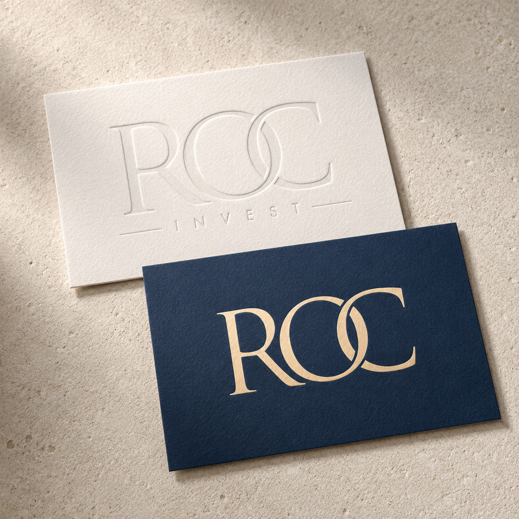 ROC Invest business card design in navy with champagne foil detail