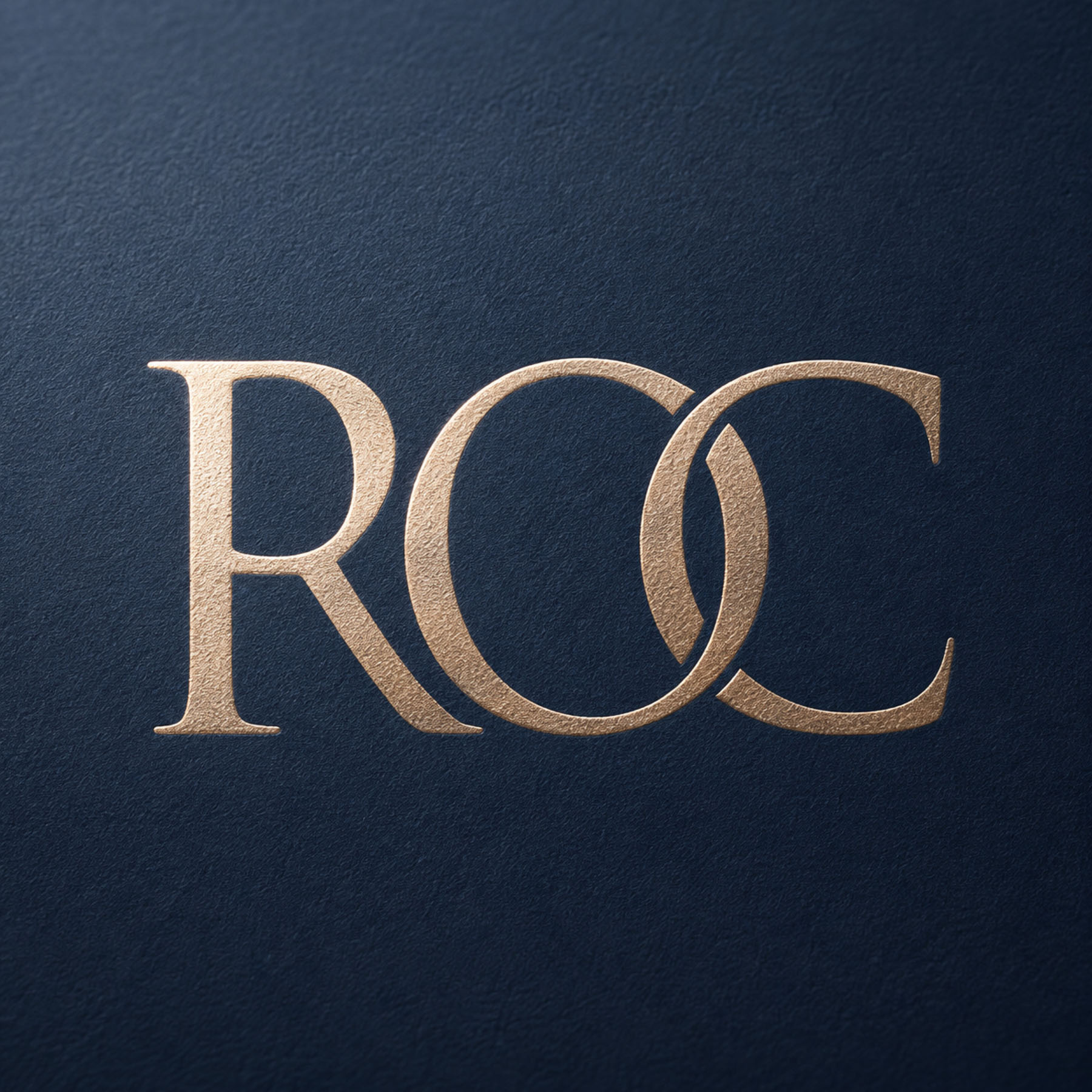 ROC Invest business card design in navy with champagne foil detail